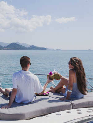 A couple relaxing on a luxury yacht representing the Ruler archetype of aspiration and success