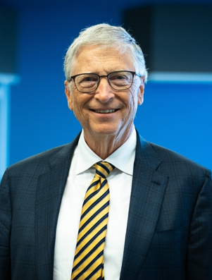 Smiling business leader in a suit and tie representing the Ruler archetype of authority and influence