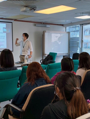 Students in a classroom listening to a teacher representing the Explorer archetype of curiosity and discovery
